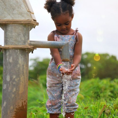 girl-washing-her-hands-at-a-water-well-in-burkina-faso-africa.jpg